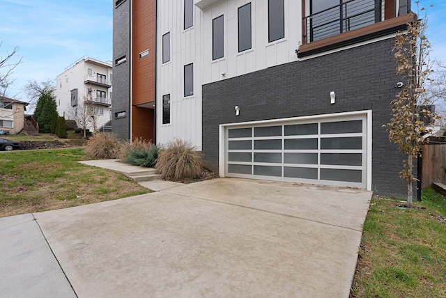 view of property exterior with a lawn and a garage