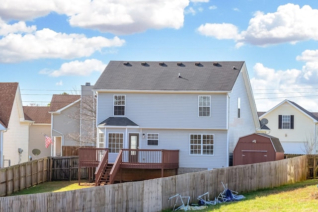 back of house featuring a deck