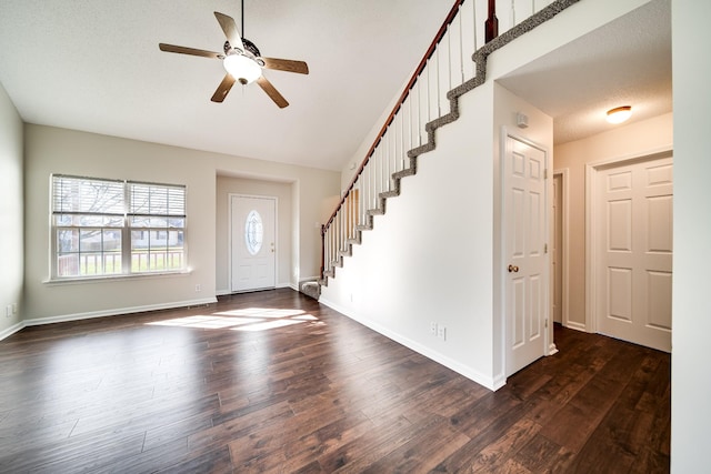 entrance foyer with ceiling fan and dark hardwood / wood-style flooring