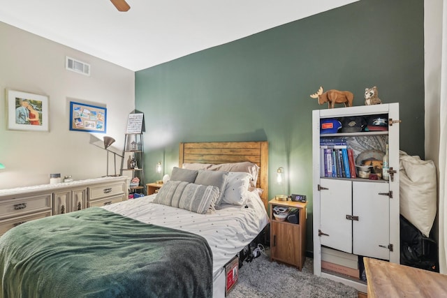 bedroom with ceiling fan and light carpet