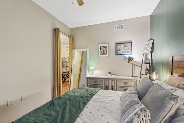 bedroom with hardwood / wood-style floors and ceiling fan