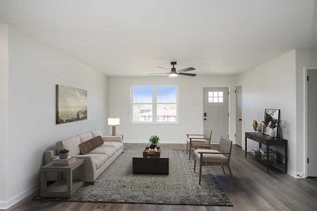 living room with ceiling fan and dark hardwood / wood-style floors