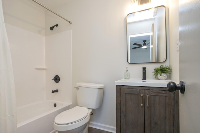 full bathroom with ceiling fan, toilet, shower / bathtub combination with curtain, and vanity