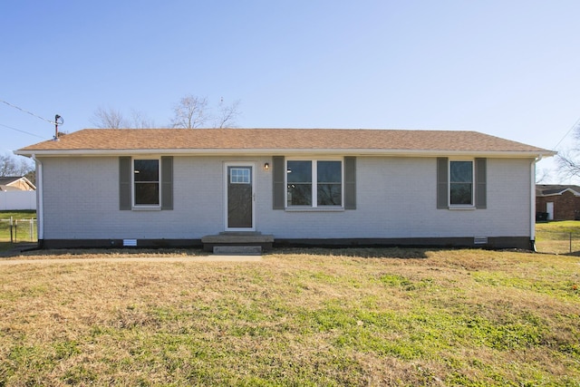 ranch-style house featuring a front yard