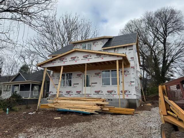 unfinished property featuring covered porch