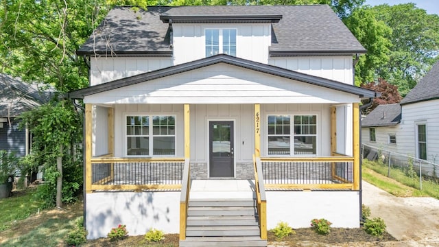 4217 Oakland Ave Lot 194, Chattanooga, TN 37410 - bungalow-style house with board and batten siding, roof with shingles, fence, and a porch