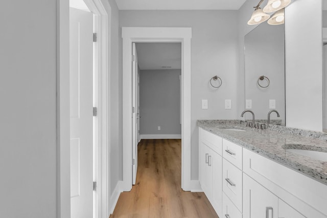 4217 Oakland Ave Lot 194, Chattanooga, TN 37410 - bathroom featuring a sink, baseboards, double vanity, and wood finished floors