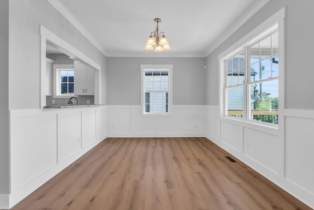 4217 Oakland Ave Lot 194, Chattanooga, TN 37410 - unfurnished dining area with visible vents, ornamental molding, wainscoting, a chandelier, and light wood-style flooring