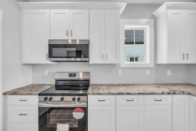 4217 Oakland Ave Lot 194, Chattanooga, TN 37410 - kitchen featuring appliances with stainless steel finishes, light stone counters, and white cabinetry