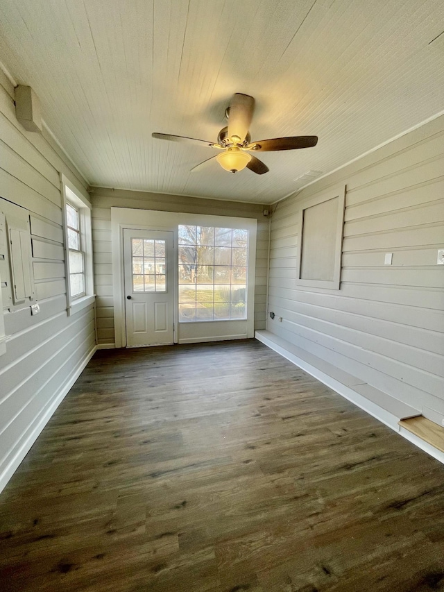 unfurnished sunroom featuring ceiling fan and wood ceiling