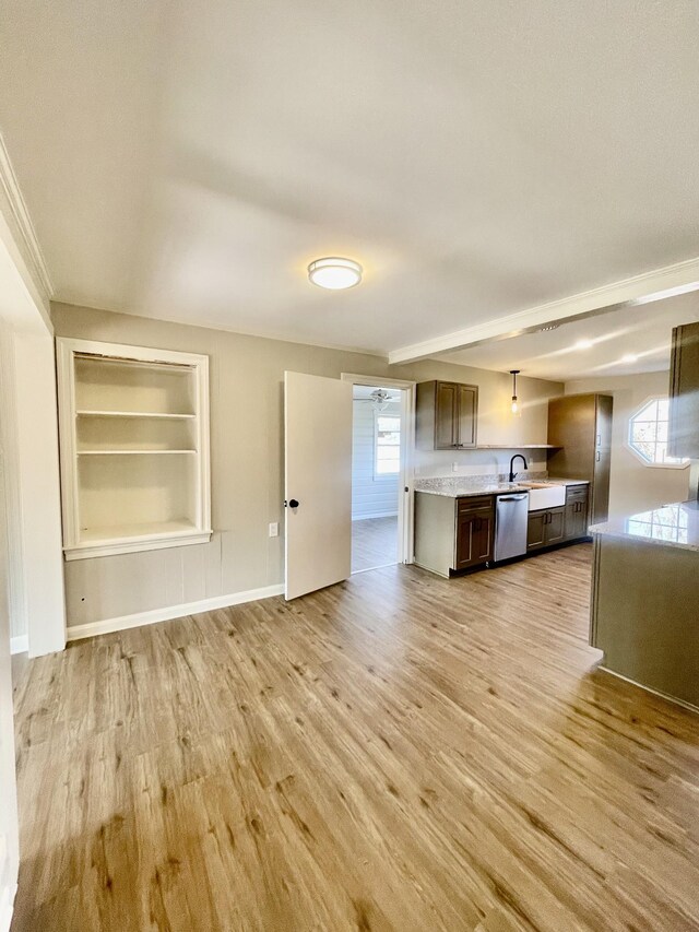 kitchen featuring dark brown cabinetry, sink, light hardwood / wood-style flooring, built in features, and dishwasher