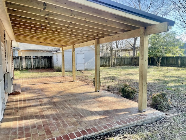 view of patio featuring a storage shed