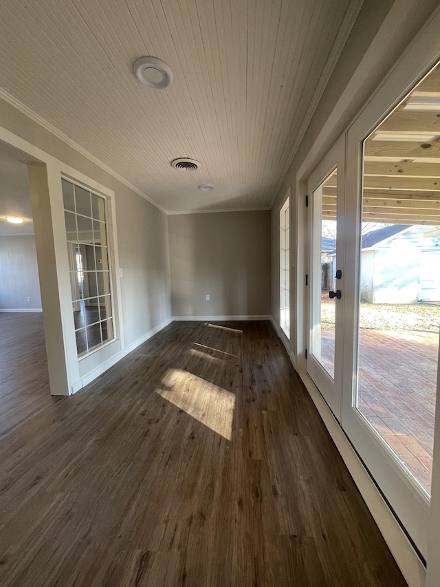 unfurnished sunroom featuring wooden ceiling