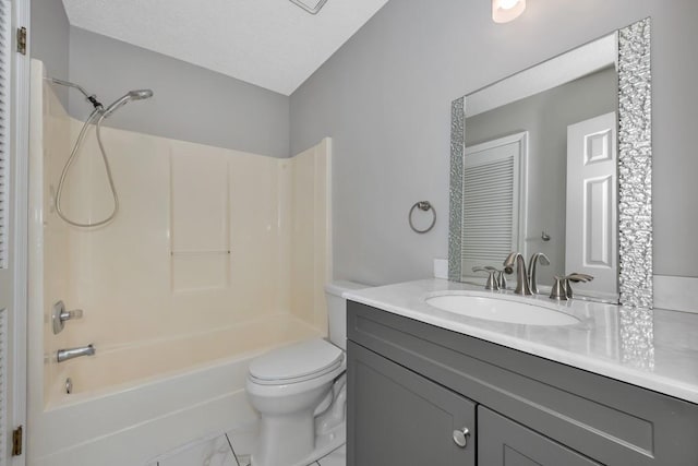 full bathroom featuring vanity, tile patterned floors, shower / washtub combination, toilet, and a textured ceiling