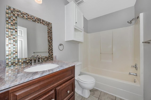 full bathroom with vanity, shower / tub combination, tile patterned floors, decorative backsplash, and toilet