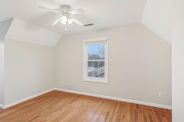 bonus room featuring ceiling fan, light wood-type flooring, and vaulted ceiling