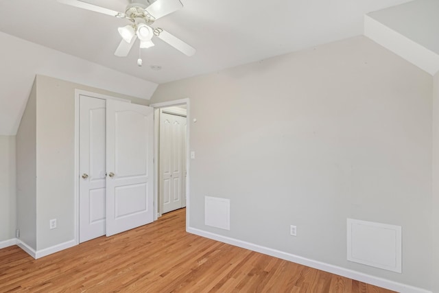 additional living space featuring ceiling fan, lofted ceiling, and light wood-type flooring