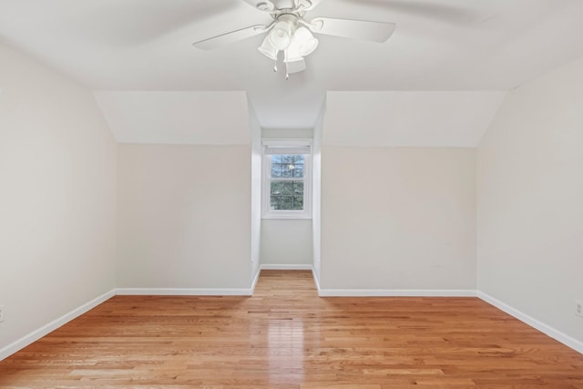 additional living space featuring light wood-type flooring, vaulted ceiling, and ceiling fan