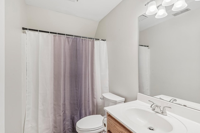 bathroom featuring vanity, a shower with shower curtain, lofted ceiling, and toilet