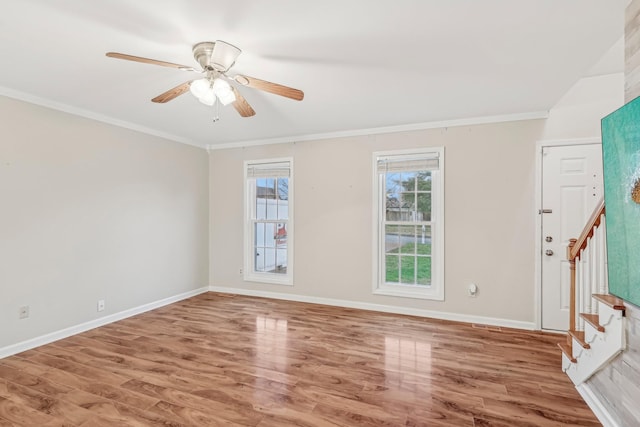 spare room with hardwood / wood-style flooring, ceiling fan, and ornamental molding