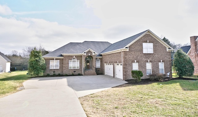 view of front of house featuring a front yard and a garage