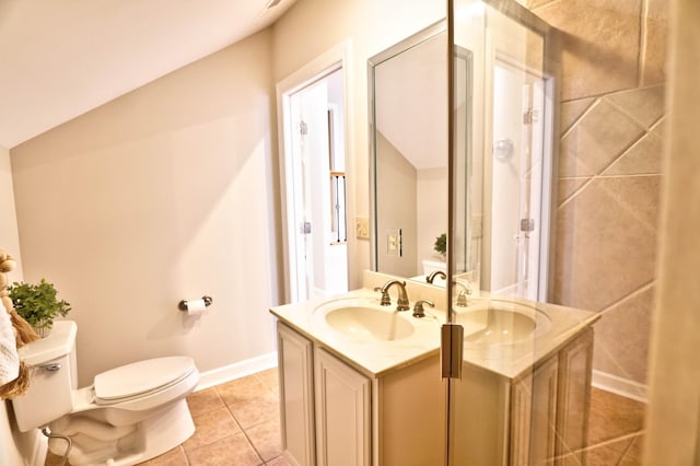 bathroom featuring tile patterned floors, vanity, and toilet