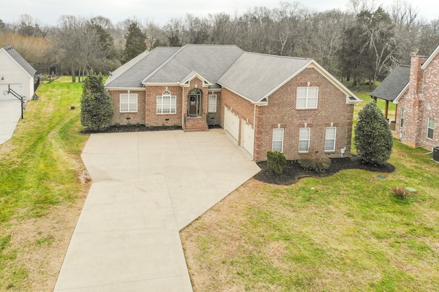 view of front of house featuring a front yard and a garage