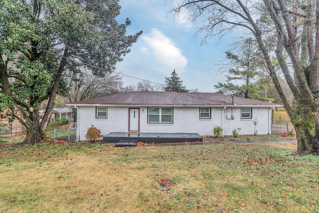 ranch-style house with a front lawn