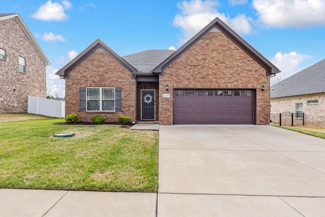 front of property featuring a front yard and a garage