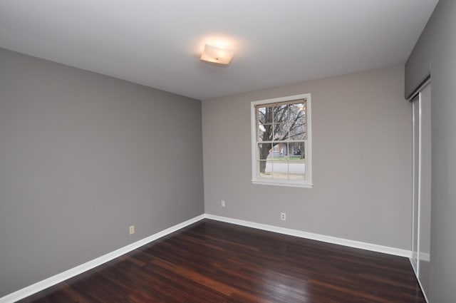 unfurnished bedroom featuring dark hardwood / wood-style flooring