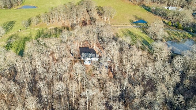 birds eye view of property featuring a rural view and a water view