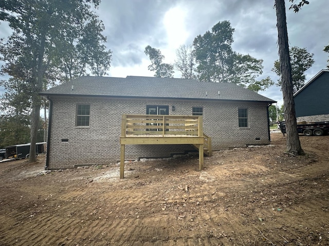 back of property featuring a deck