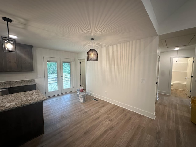 unfurnished dining area featuring french doors and wood-type flooring