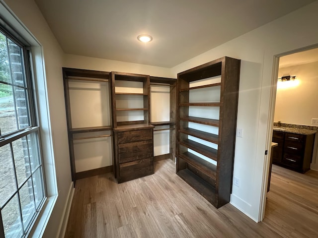 walk in closet featuring light wood-type flooring