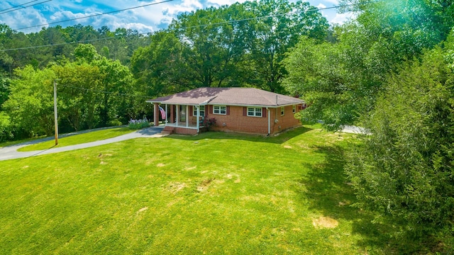 view of front of property with a front lawn and covered porch