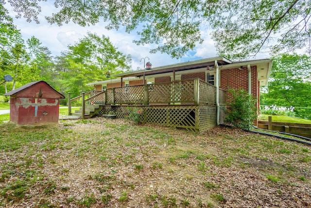 view of yard with a storage unit and a deck