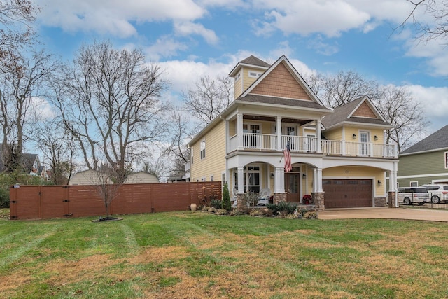 craftsman house with covered porch, a garage, a balcony, and a front yard