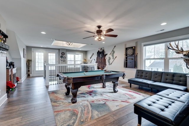 rec room featuring wood-type flooring, ceiling fan, a healthy amount of sunlight, and billiards