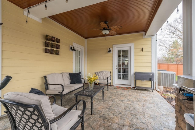 view of patio featuring central air condition unit, an outdoor living space, and ceiling fan