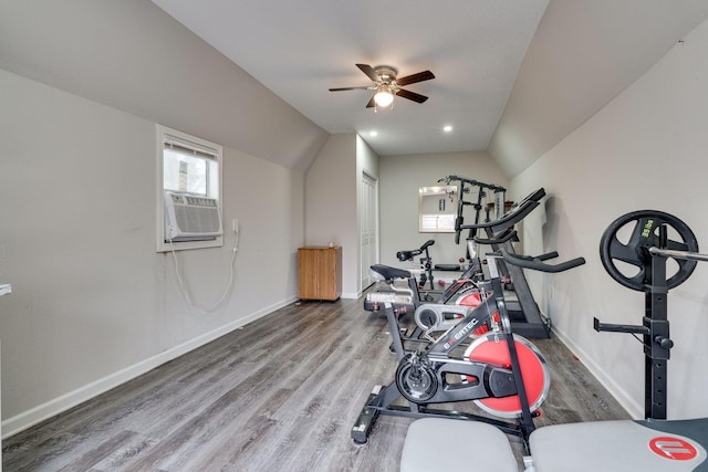 exercise area with ceiling fan, hardwood / wood-style floors, cooling unit, and lofted ceiling