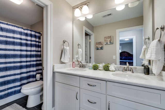 bathroom with tile patterned flooring, vanity, curtained shower, and toilet