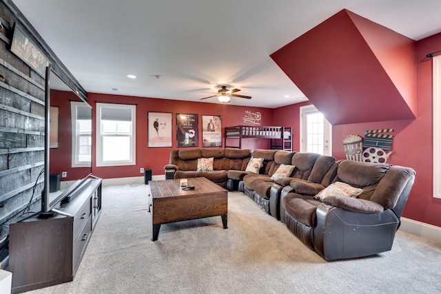 carpeted living room featuring ceiling fan