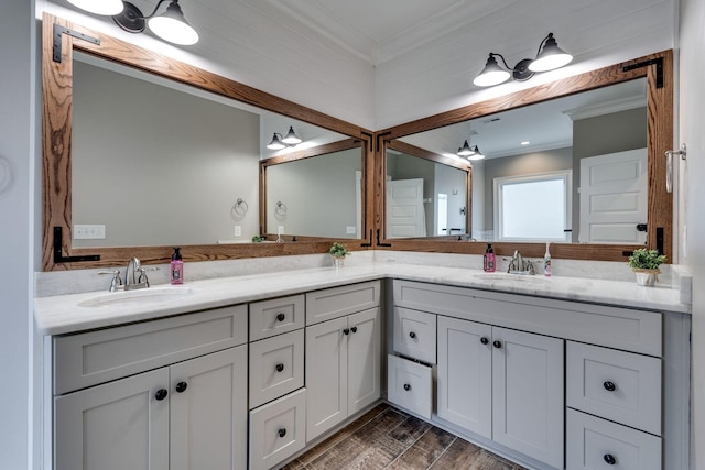 bathroom featuring vanity, wood-type flooring, and crown molding