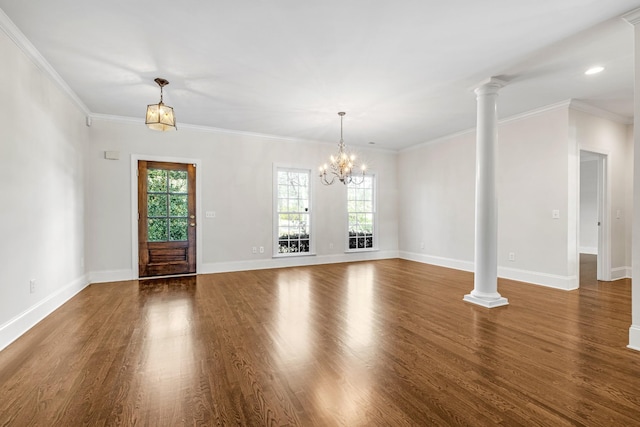 entrance foyer with crown molding, dark wood-type flooring, and decorative columns