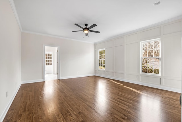 spare room with ornamental molding, dark hardwood / wood-style floors, and ceiling fan