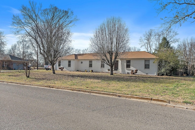 ranch-style house with a front lawn