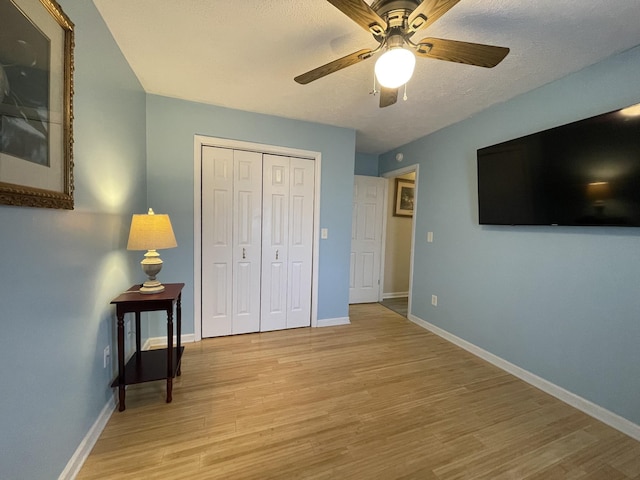 173 Twin Oaks Dr, Hohenwald, TN 38462 - bedroom featuring light wood-style flooring, a closet, and ceiling fan