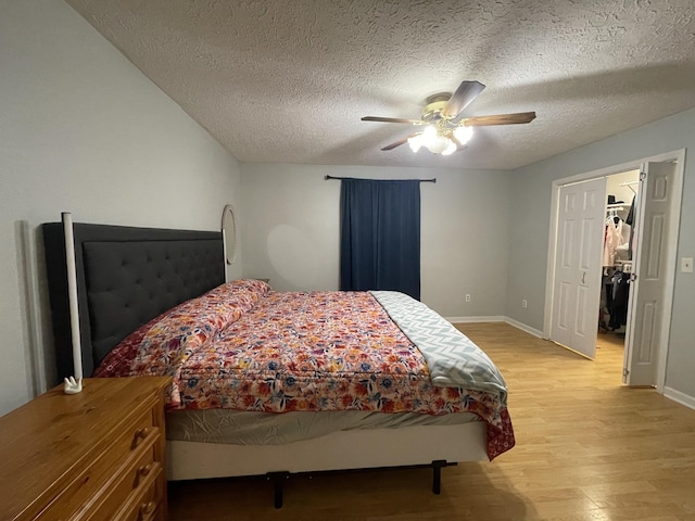 173 Twin Oaks Dr, Hohenwald, TN 38462 - bedroom with light wood-style floors, a textured ceiling, and a ceiling fan