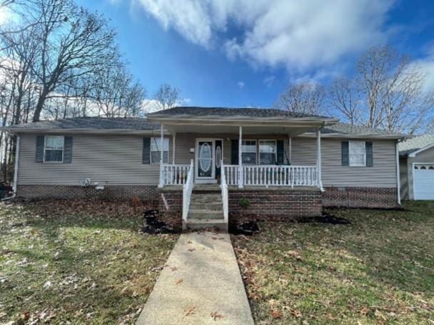 single story home featuring a porch and a front yard