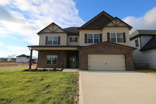 craftsman inspired home with a front yard and a garage